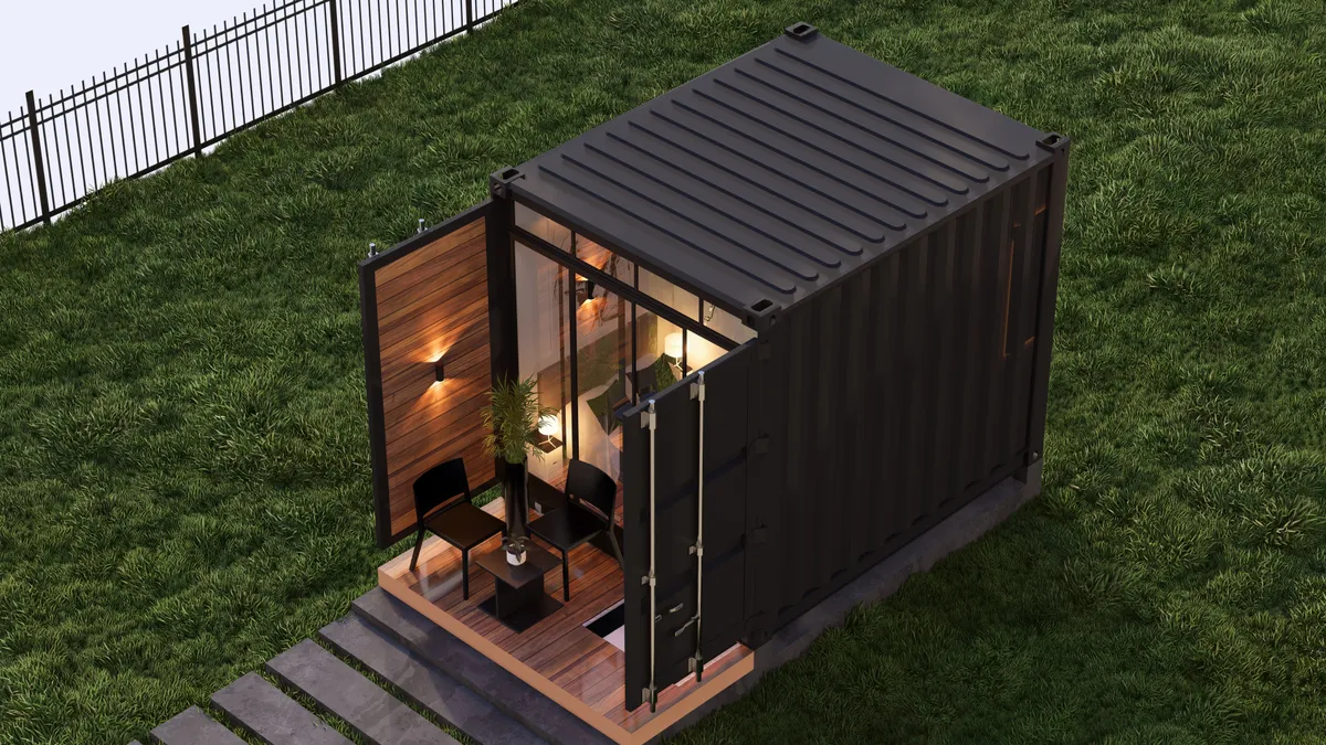 Person holding green flower bud.